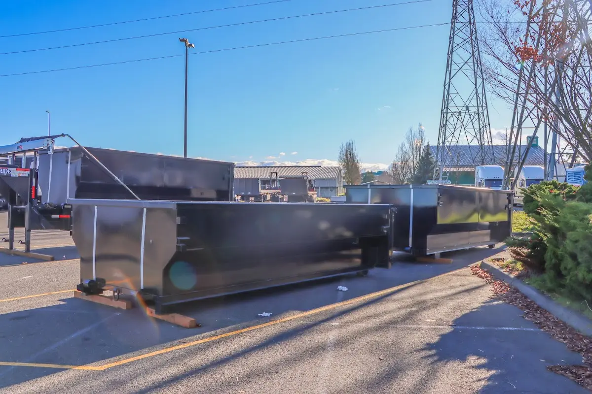 Roll-off dumpster ready for waste disposal at job site for 12 Yard Dumpster Rental in Macon-Bibb County